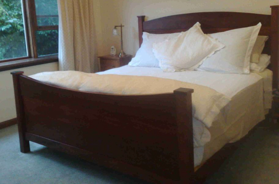 dark timber curved bed frame
